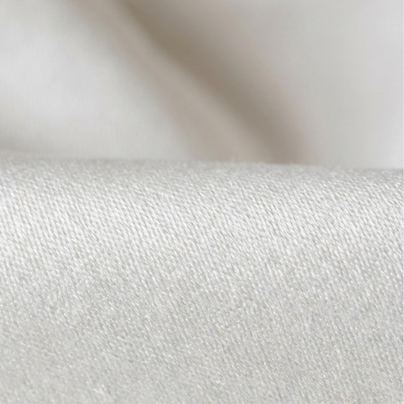 White waterproof protector with soft TENCEL fabric, zippered closure, and breathable moisture-resistant barrier protecting a standard pillow or mattress from spills, sweat, and allergens.